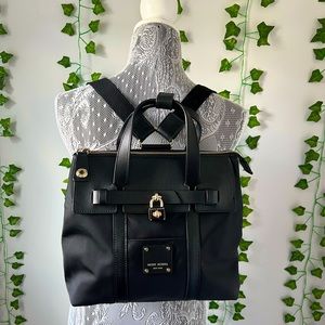 Henri bendel versatile black purse/ back pack with leather accents.
